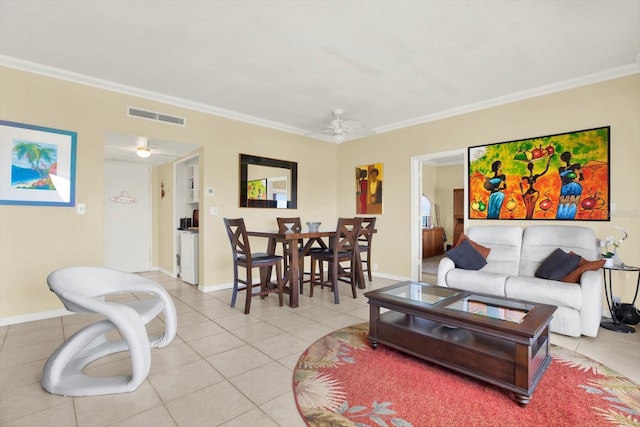 living room with ornamental molding, visible vents, ceiling fan, and light tile patterned flooring