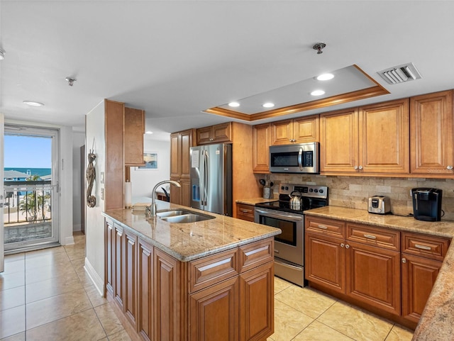 19925 Gulf Blvd Unit 402, Indian Shores, FL 33785 - kitchen featuring light tile patterned floors, visible vents, decorative backsplash, stainless steel appliances, and a sink