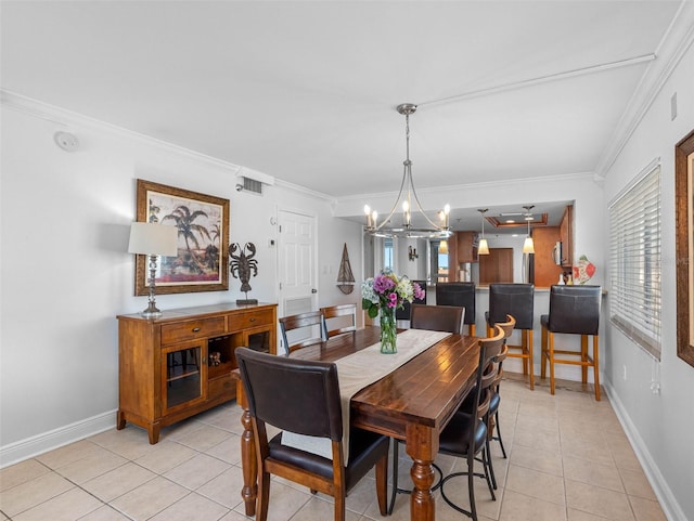 19925 Gulf Blvd Unit 402, Indian Shores, FL 33785 - dining room with an inviting chandelier, baseboards, crown molding, and light tile patterned flooring