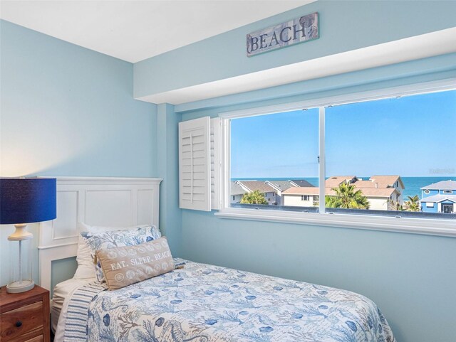19925 Gulf Blvd Unit 402, Indian Shores, FL 33785 - bedroom featuring a decorative wall and wainscoting
