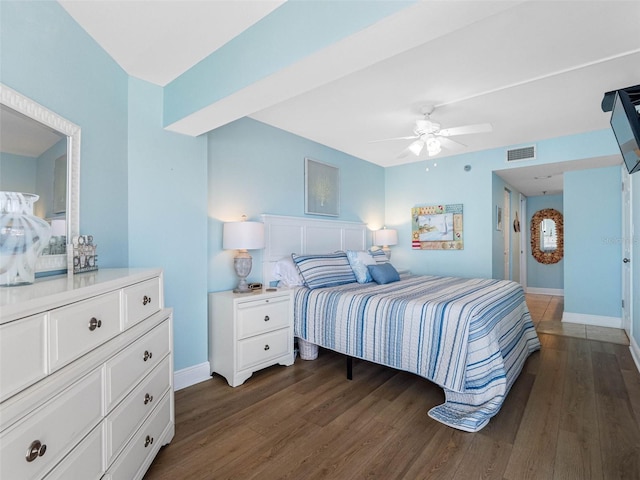 19925 Gulf Blvd Unit 402, Indian Shores, FL 33785 - bedroom with dark wood-type flooring, visible vents, baseboards, and ceiling fan