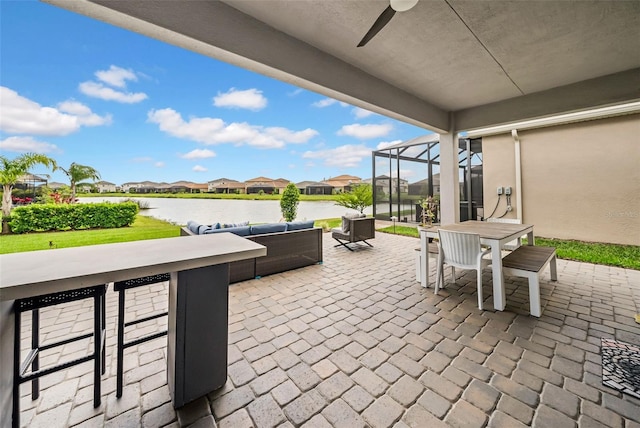 3096 Great Banyan Way, Wesley Chapel, FL 33543 - view of patio featuring a residential view, a water view, a ceiling fan, outdoor lounge area, and outdoor dining space