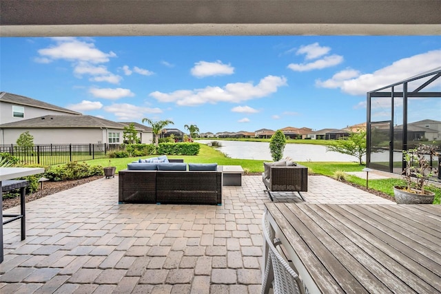 3096 Great Banyan Way, Wesley Chapel, FL 33543 - view of patio / terrace featuring a water view, a residential view, outdoor lounge area, and glass enclosure