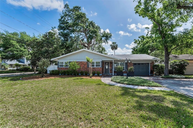 202 S Hesperides St, Tampa, FL 33609 - single story home featuring brick siding, an attached garage, driveway, and a front yard