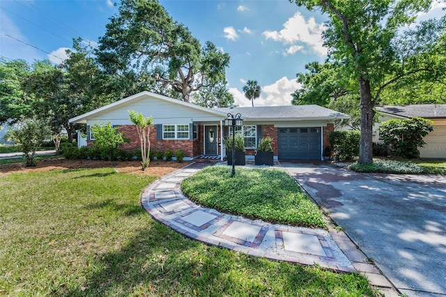 202 S Hesperides St, Tampa, FL 33609 - ranch-style house featuring brick siding, an attached garage, driveway, and a front yard