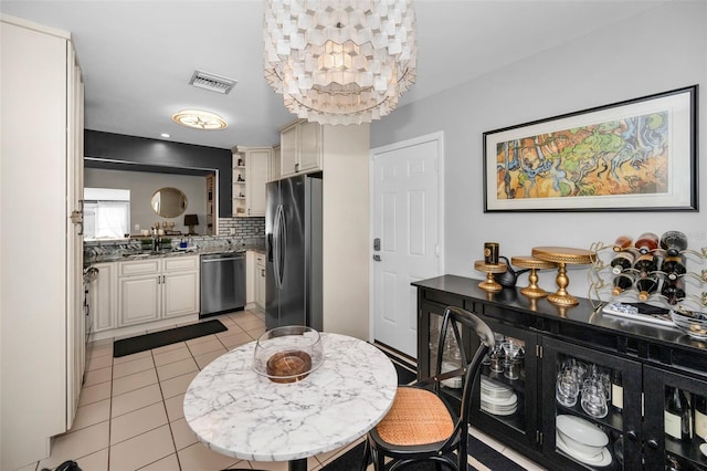202 S Hesperides St, Tampa, FL 33609 - dining room featuring light tile patterned flooring
