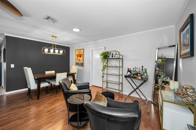 202 S Hesperides St, Tampa, FL 33609 - living room featuring ornamental molding, wood finished floors, recessed lighting, and a chandelier