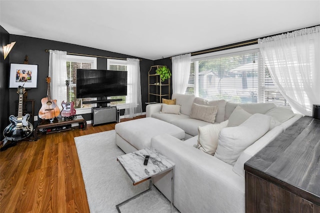 202 S Hesperides St, Tampa, FL 33609 - living room with lofted ceiling and wood finished floors