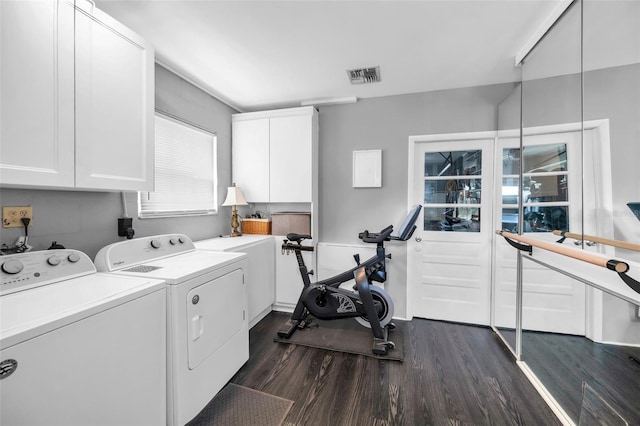 202 S Hesperides St, Tampa, FL 33609 - laundry area with washer and clothes dryer, cabinet space, and dark wood finished floors