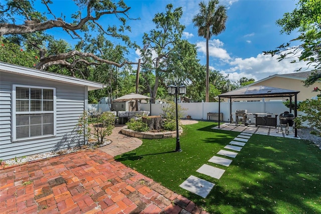 202 S Hesperides St, Tampa, FL 33609 - fenced backyard with a gazebo, an outdoor living space, and a patio area