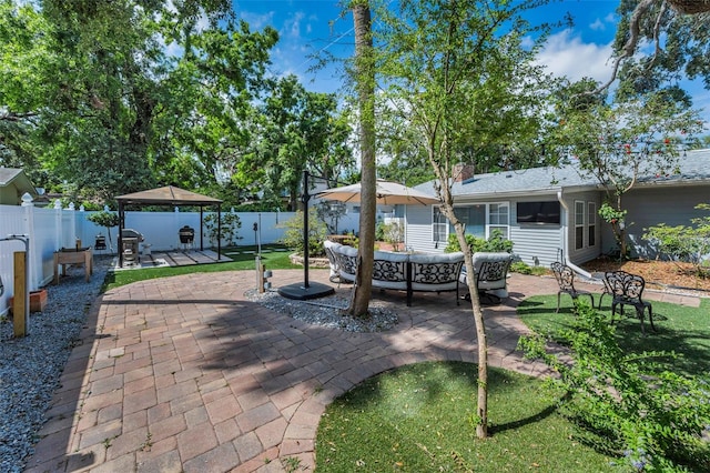 202 S Hesperides St, Tampa, FL 33609 - fenced backyard featuring a patio, a gazebo, and an outdoor hangout area