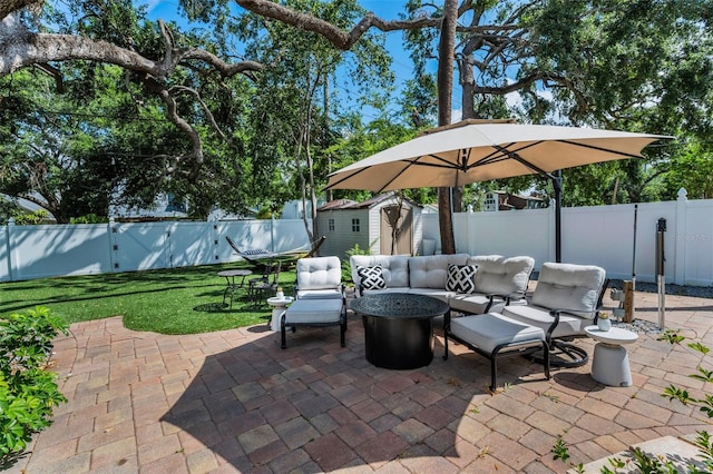 202 S Hesperides St, Tampa, FL 33609 - fenced backyard featuring a patio and a storage shed