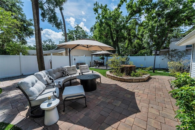 202 S Hesperides St, Tampa, FL 33609 - fenced backyard with a patio area and an outdoor living space with a fire pit