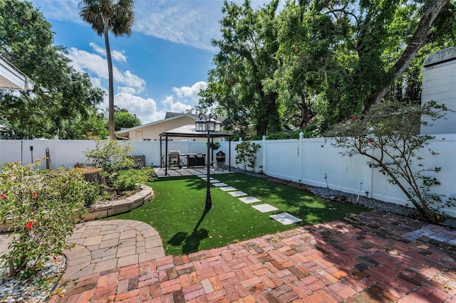 202 S Hesperides St, Tampa, FL 33609 - fenced backyard with a patio and a gazebo