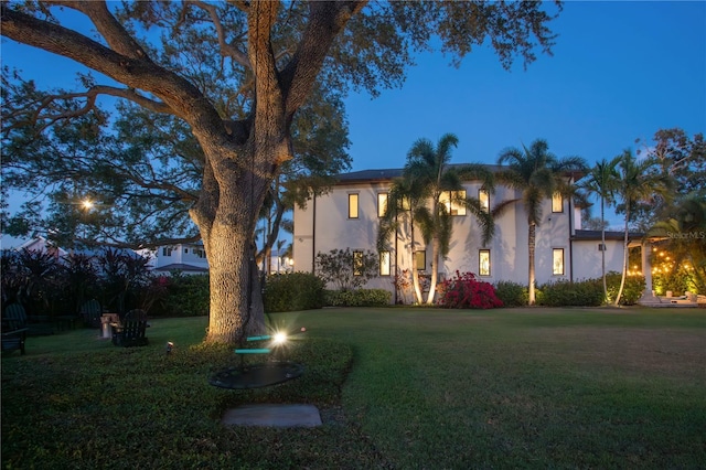 2501 S Dundee St, Tampa, FL 33629 - mediterranean / spanish-style house with stucco siding and a front yard