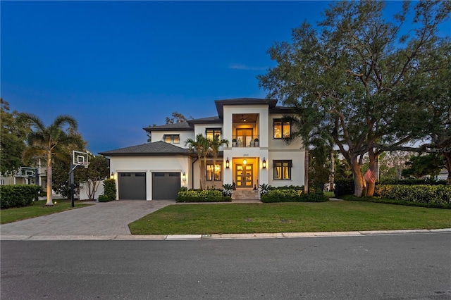 2501 S Dundee St, Tampa, FL 33629 - view of front of home featuring french doors, stucco siding, an attached garage, and a front lawn