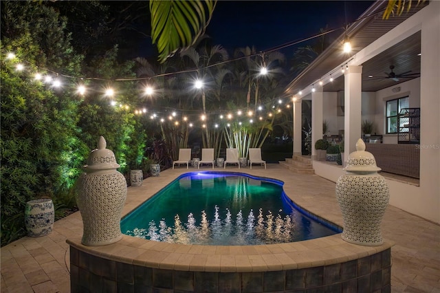 2501 S Dundee St, Tampa, FL 33629 - pool at twilight featuring a patio area, ceiling fan, and an outdoor pool