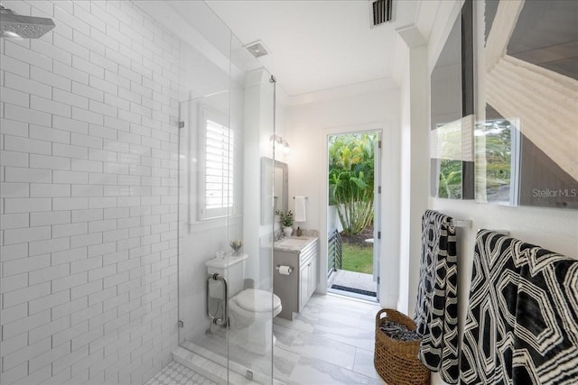 2501 S Dundee St, Tampa, FL 33629 - full bathroom featuring a tile shower, vanity, and toilet