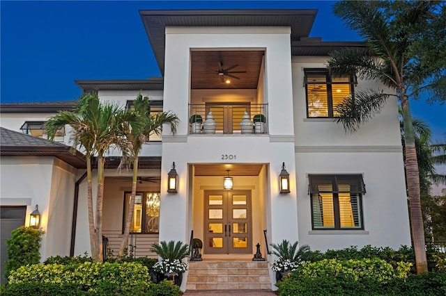 2501 S Dundee St, Tampa, FL 33629 - view of front of property featuring a balcony, stucco siding, and a ceiling fan
