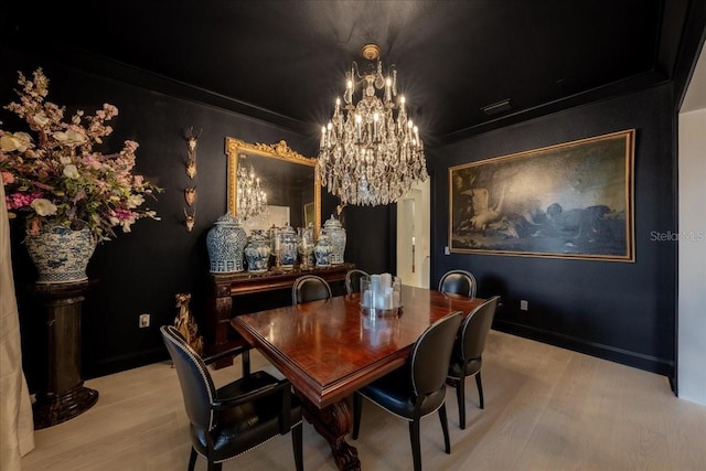 2501 S Dundee St, Tampa, FL 33629 - dining area featuring a chandelier and light wood-type flooring