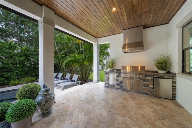 2501 S Dundee St, Tampa, FL 33629 - view of patio featuring a grill and an outdoor kitchen