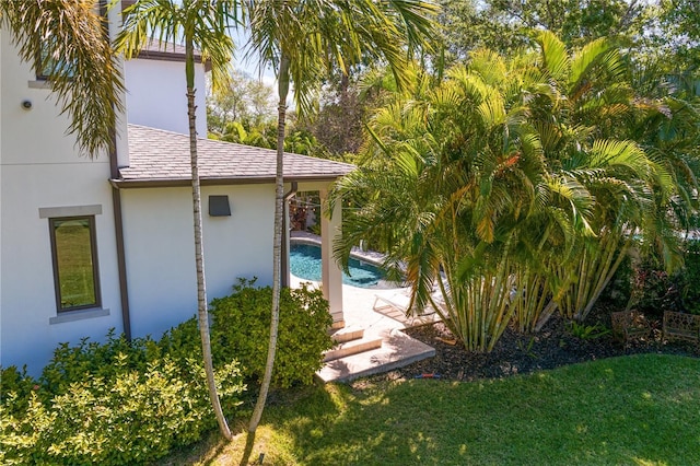 2501 S Dundee St, Tampa, FL 33629 - back of property with stucco siding, an outdoor pool, and a lawn