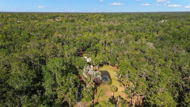 bird's eye view featuring a forest view