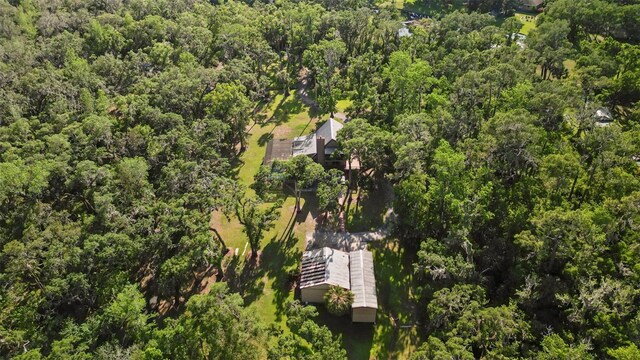 bird's eye view featuring a wooded view