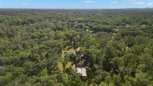 bird's eye view featuring a wooded view