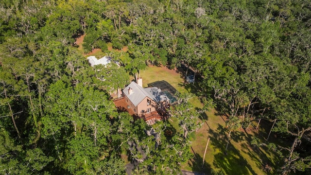 drone / aerial view featuring a forest view