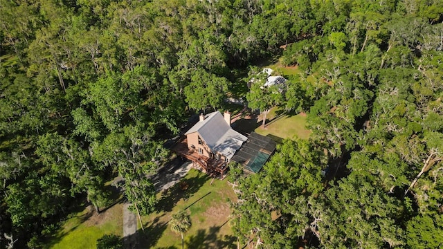 aerial view featuring a wooded view