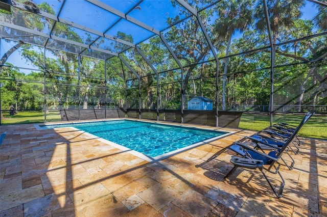 outdoor pool with a patio area, an outdoor structure, a storage unit, and a lanai