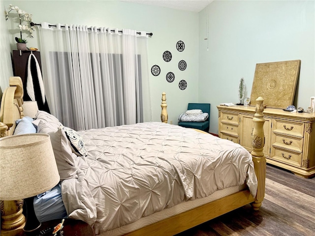 bedroom featuring wood finished floors