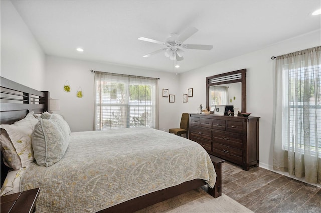 bedroom with dark wood-style flooring, recessed lighting, and a ceiling fan