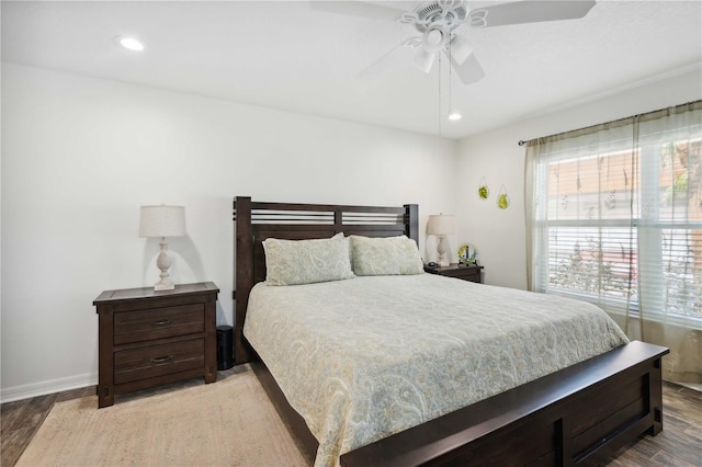 bedroom featuring wood finished floors, baseboards, a ceiling fan, and recessed lighting