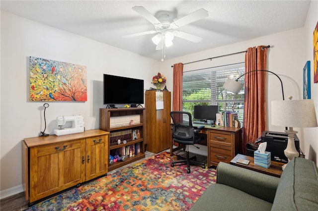 office featuring ceiling fan and baseboards