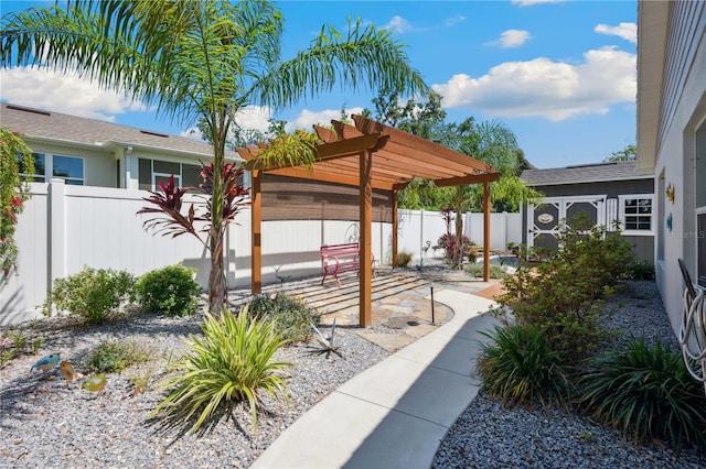 exterior space with a pergola, a fenced backyard, and a patio area