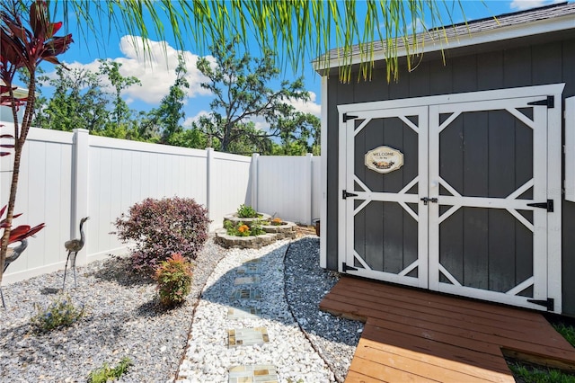 view of shed with a fenced backyard