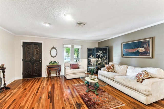 11383 Pickford St, Spring Hill, FL 34609 - living area with ornamental molding, wood-type flooring, a textured ceiling, and visible vents