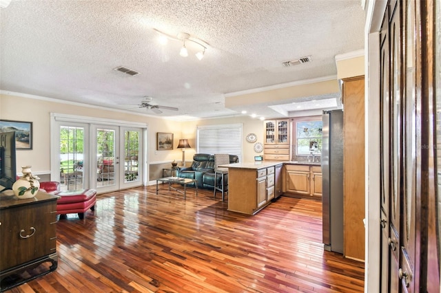 11383 Pickford St, Spring Hill, FL 34609 - interior space with freestanding refrigerator, a textured ceiling, open floor plan, and ornamental molding