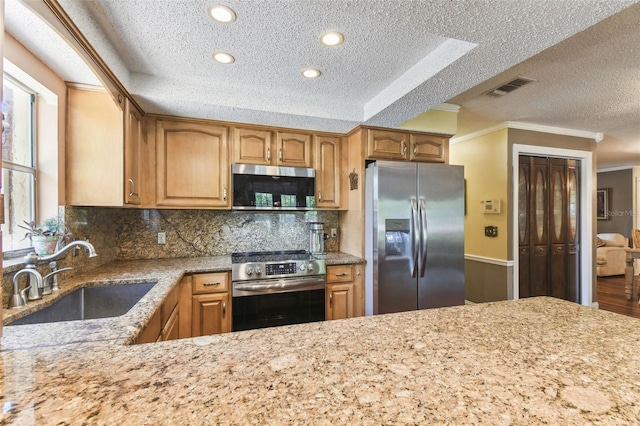 11383 Pickford St, Spring Hill, FL 34609 - kitchen with crown molding, a textured ceiling, appliances with stainless steel finishes, and a sink
