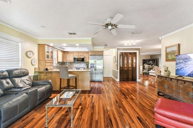 11383 Pickford St, Spring Hill, FL 34609 - living area featuring crown molding, dark wood-style flooring, ceiling fan, a textured ceiling, and visible vents