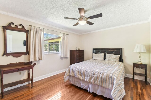 11383 Pickford St, Spring Hill, FL 34609 - bedroom with wood-type flooring, a textured ceiling, ornamental molding, and baseboards