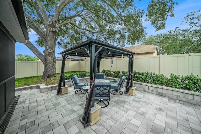 1830 Citrus Orchard Way, Valrico, FL 33594 - view of patio / terrace with a gazebo, outdoor dining area, and a fenced backyard