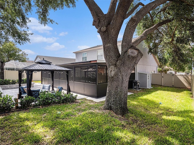 1830 Citrus Orchard Way, Valrico, FL 33594 - view of yard featuring outdoor lounge area, fence, a patio area, a gazebo, and a gate