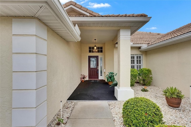 entrance to property with stucco siding