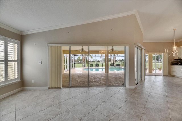 empty room with ceiling fan with notable chandelier, light tile patterned flooring, baseboards, and ornamental molding