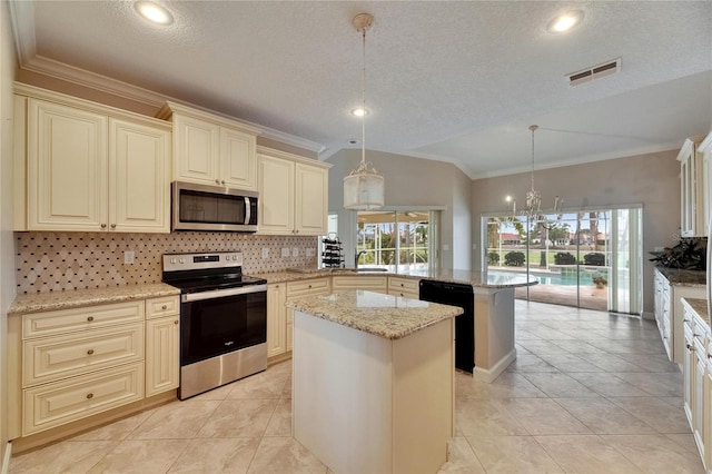 kitchen featuring a peninsula, visible vents, cream cabinetry, and appliances with stainless steel finishes