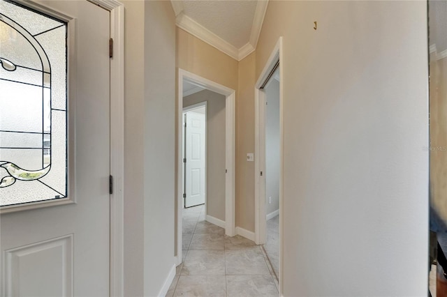 corridor with crown molding and baseboards