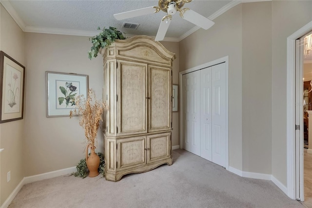 unfurnished bedroom with light carpet, a closet, ceiling fan, and visible vents